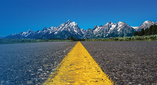 Highway with mountain range in the distance